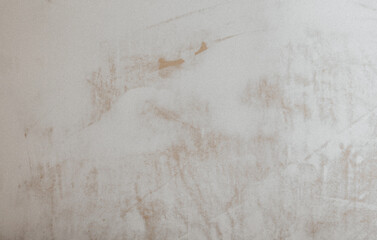 A drywall plastered surface with rough brush strokes texture. Paint brushed old white wall background. - 509535711