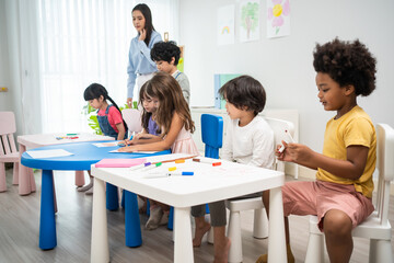 Caucasian beautiful woman teacher teach fun activity to kids at school	