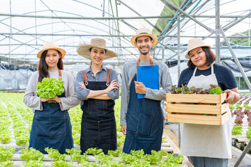 Portrait Group of Asian farmers worker in vegetables hydroponic farm.