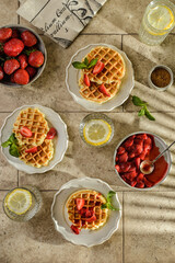 waffles with strawberries and sauce