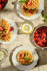waffles with strawberries and sauce
