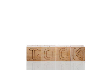 Wooden cubes with letters took on a white background