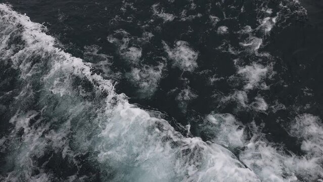 Sea wash off side of boat