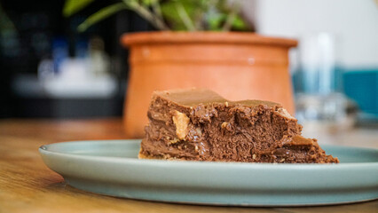 chocolate cheesecake on a pale blue plate