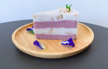 Abstract photo of sweet taro layered cake consist with purple layer of cake and coconut milk cream layer