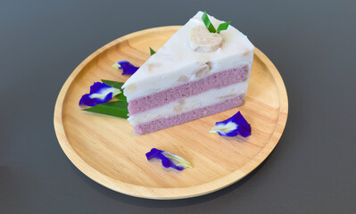 Abstract photo of sweet taro layered cake consist with purple layer of cake and coconut milk cream layer