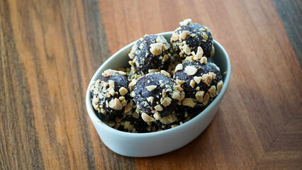 Chocolate date balls with peanut butter sprinkles