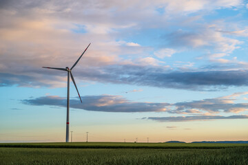 Obraz premium wind turbine at sunset
