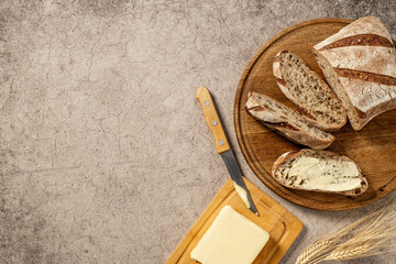 Bread with dried fruits and butter. Healthy home baked loaf top view