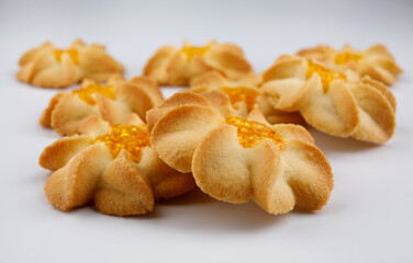 Shortbread cookies on a light background . Kurabye cookies with jam . Cookies in the shape of a flower .