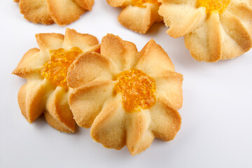 Shortbread cookies on a light background . Kurabye cookies with jam . Cookies in the shape of a flower .