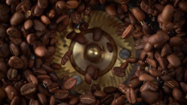 Grinding Roasted Coffee Beans Spinning in Burr Grinder in Slow Motion - Table Top View