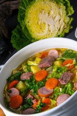 delicious savoy cabbage soup in white vase