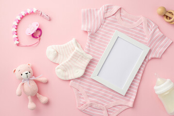 Baby concept. Top view photo of photo frame pink infant clothes bodysuit socks baby's dummy chain...
