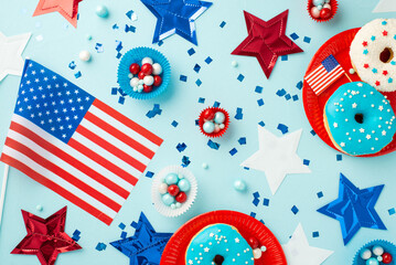 Obraz premium USA Independence Day concept. Top view photo of national flags star garland confetti paper backing molds with candies and plate with glazed donuts on isolated pastel blue background