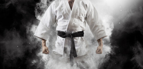 Man in white kimono with black belt