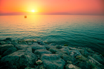 Rocky shore of the Sea of Galilee at sunrise