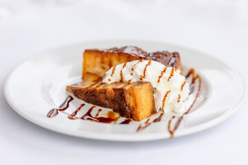 Traditional spanish dessert Ibizan Greixonera (Balearic pudding) with whipped cream