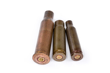 Spent shells from assault rifles different caliber on white background