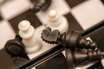 Chess pieces on a chessboard. Close-up, selective focus