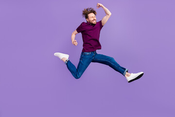 Full body profile side photo of young man runner active rush discount isolated over violet color...