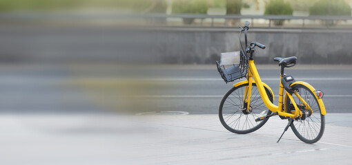  Black and yellow retro bicycle in city.