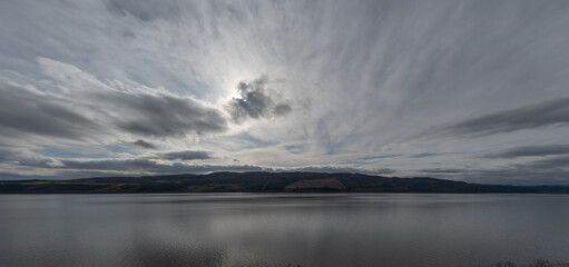 wispy clouds over lake