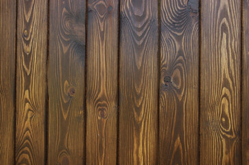 The texture of pine tinted under oak. Fence surface.
