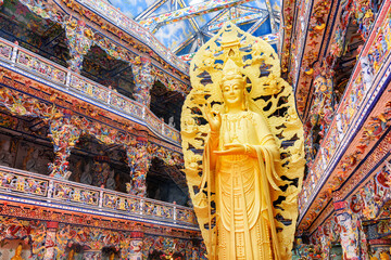 Golden Buddha statue in the Linh Phuoc Pagoda in Da Lat city