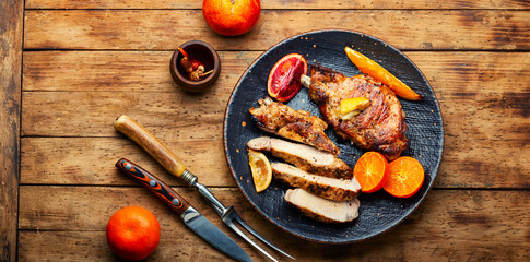 Barbecue meat steak with citrus fruits.