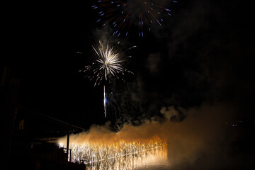 town fireworks with colored palm trees