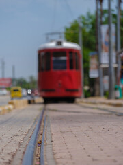 old red tram on the railway
