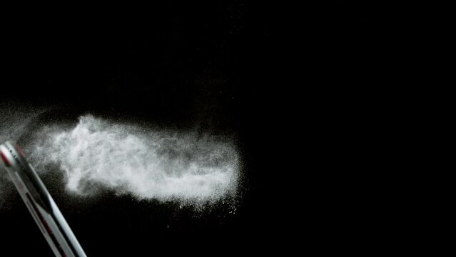 Super slow motion of hitting tenis ball with powder explosion. Filmed on high speed cinema camera, 1000fps.