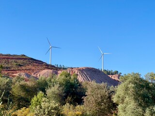 Wind turbines on beautiful sunny mountain landsape.