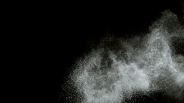 Super slow motion of hitting tenis ball with powder explosion. Filmed on high speed cinema camera, 1000fps. Speed ramp effect.