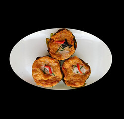 Thai steamed fish with curry paste(Ho mok) on white plate, isolated on black background with clipping path