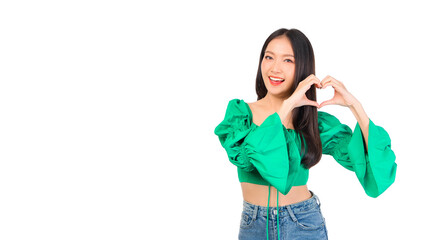 Attractive beautiful positive happy smile asian woman hands point up and pose with empty space wearing green shirt and jeans.
