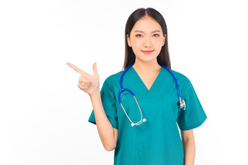 Portrait of professional confident young asian female smiling doctor in green scrubs showing presenting finger to empty space, doctor healthcare and doctors concept.