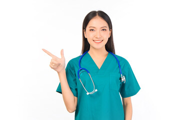 Portrait of professional confident young asian female smiling doctor in green scrubs showing presenting finger to empty space, doctor healthcare and doctors concept.