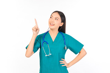 Portrait of professional confident young asian female smiling doctor in green scrubs showing presenting finger to empty space, doctor healthcare and doctors concept.
