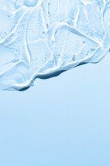 Transparent cosmetic texture. Skin serum or washing gel. Macrophotography. Copy space.