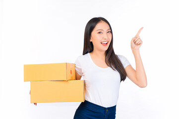 Happy cute asian woman smiling and holding package online marketing and delivery Start a small business at home on white background, Delivery shipping service concept.