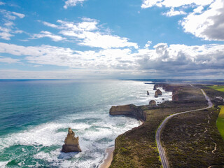 Aerial view on a sunny day with clouds of 12 apostles along the Great Ocean Road, Victoria,...