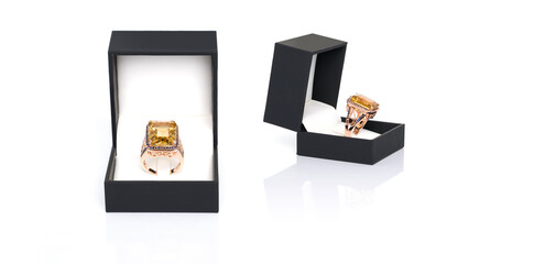 Citrine with Blue Sapphire ring in dark blue jewel box. Collection of natural gemstones...