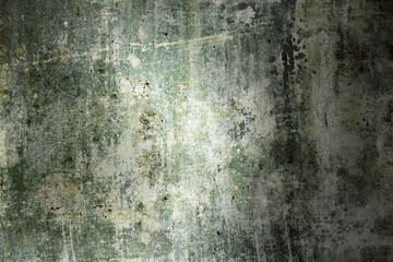 Abstract grungy white wall background with green patches