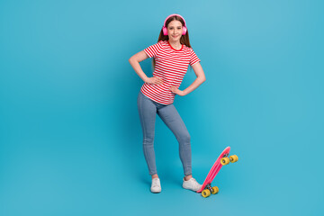 Full size photo of young girl listen music headphones meloman mp3 ride skateboard isolated over...