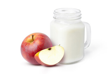 glass of milk and apple on white