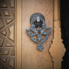 door metal handle in the mosque decorated with beautiful patterns