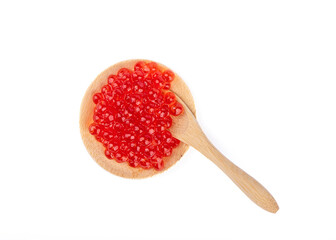 Serving wooden mini plate and mini spoon with red caviar isolated on white background.