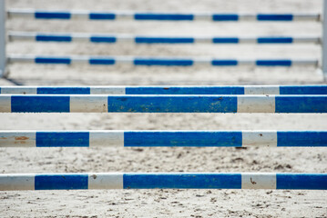 Horse jumping over obstacles. wooden obstacle at competition